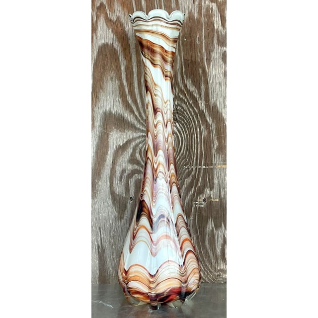 Enrich your decor with the captivating allure of this Vintage Boho Slag Glass Swirl Vase, echoing the timeless elegance of...