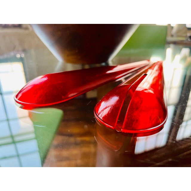 Add a splash of excitement to your dining experience with these vibrant red acrylic pop art salad servers. Designed to...