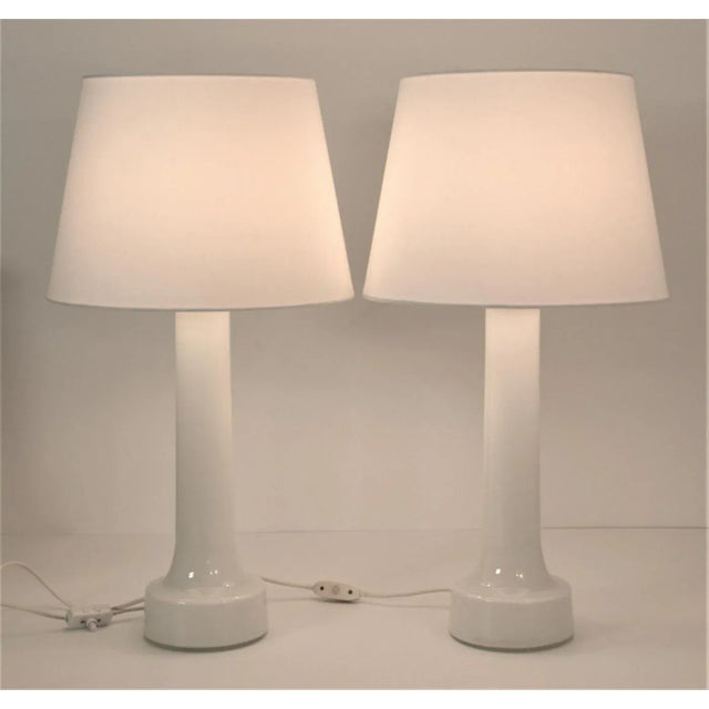 Large doublecoated art glass table lamps made at Orrefors for Bergboms in the 1960´s. The pair is in excellent condition...
