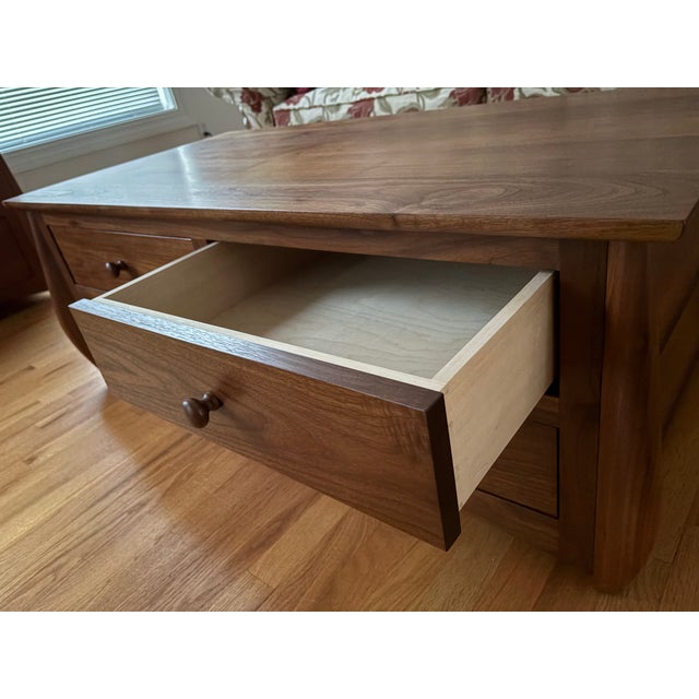walnut coffee table with four soft closing drawers. all drawer boxes are dovetailed. unique leg design Hand made by...