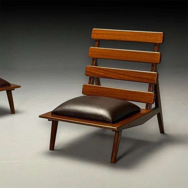 Sergio Rodrigues Style, Brazilian Mid-Century Modern, Sculptural Lounge or Slipper Chairs, Mahogany, Leather This pair of...