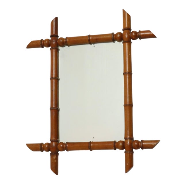 Antique faux bamboo mirror with original mirror plate and a planked back, entirely in Chinoiserie style; this style was...