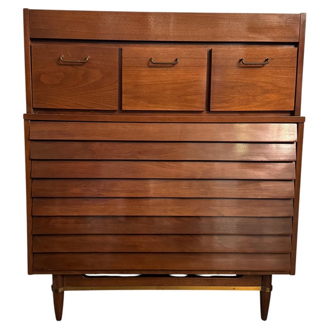 Similar to Merton Gershun's designs for the "Dania" collection by American of Martinsville, this walnut highboy dresser by...