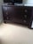 French Art Deco inspired (three) drawer chest in mahogany veneers with nickel ring pulls and sabot. Finish: Dark coffee...