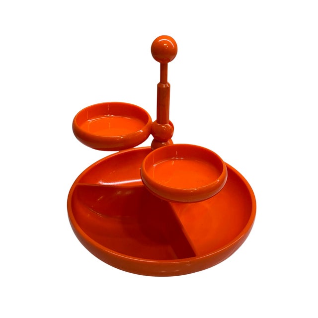 A striking vintage Space Age organizer made in West Germany, featuring a vivid glossy orange finish and an unusual...