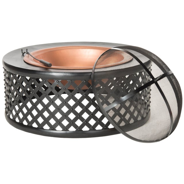 With it's antique look and design, the fire pit in dark copper and black features a bowl with lattice motif a country...