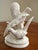 Vintage white bisque porcelain figurine of a pair of pheasants positioned together on a base with one bird displaying...