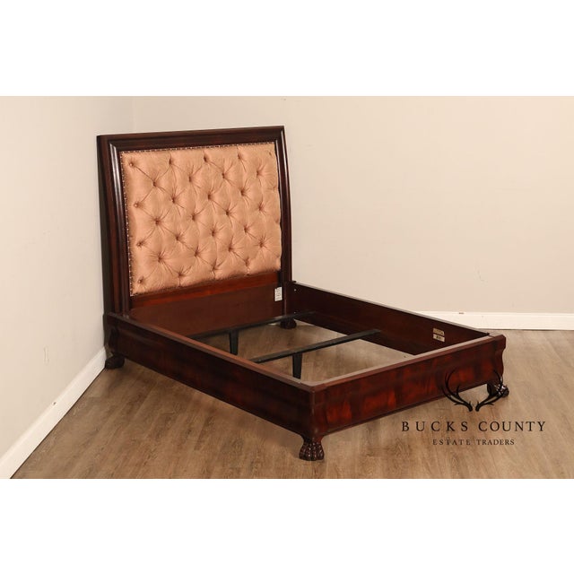 Elegant Henredon queen-size bed crafted in richly figured mahogany with a warm traditional finish. Features a substantial...