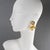 The House of Goossens reinterprets the timeless concept of the flower. Consisting of four carved gilded metal petals,...