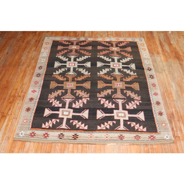 mid 20th Century Turkish Kars rug with a primitive and abstract geometric design size 7' 1" x 8' 7" (216 x 262 cm).