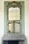 This large overmantel mirror in carved wood, from the Transition period (18th century), marks the evolution between the...