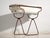 This antique bathtub in enamelled iron rests on a folding stand of bent iron tube. Originates from Central Europe, from...