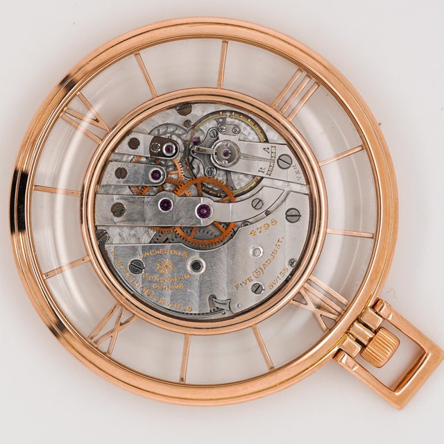 This rare vintage Vacheron Constantin pocket watch is crafted in 18K rose gold with a fully skeletonized case back and...
