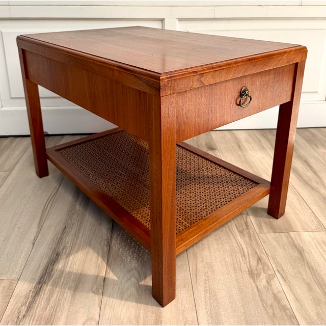 This handsome 1960's side table combines clean architectural lines with thoughtful decorative details. Crafted with a rich...