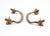 Vintage drawer pulls made of brass with a thin curved bridge design. The original mounting screws are included. Good...