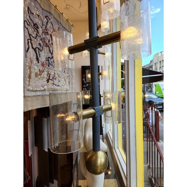 Dims.: 26.6" Diameter x 68"H Origin: Germany Circa: 1960's Brass with black enamel frame and (8) hand-blown glass....