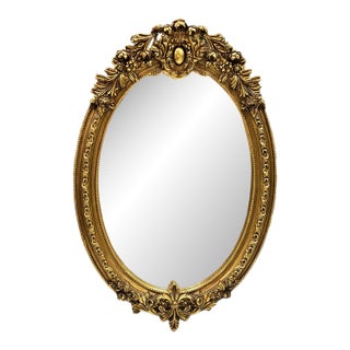 French Oval Wall Mirror – Hand Carved Gold Leaf Frame With Ornate Floral Details For Sale