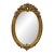 French Oval Wall Mirror – Hand Carved Gold Leaf Frame With Ornate Floral Details For Sale