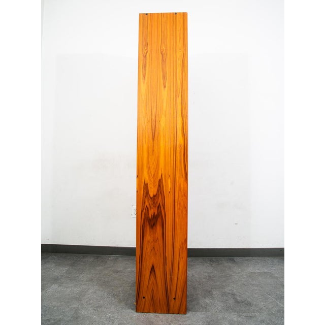Functional compact bookshelf in teak with single door cabinet section below. Bottom section offers cabinet door with solid...