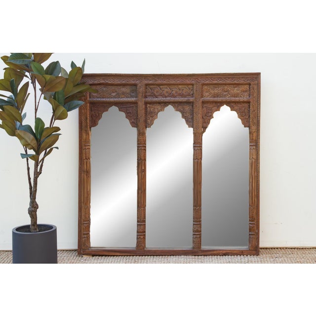 The Mandala Arch Mirror is a monumental square mirror that serves as a literal window into the past. Repurposed from a...