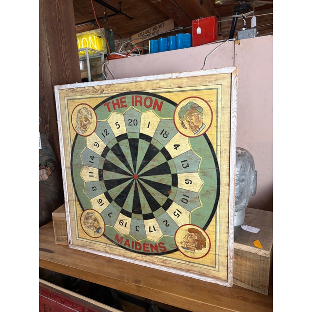 Vintage "Iron Maidens" carnival target sign. Features a hand-painted design with a naturally weathered, authentic patina....