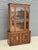 C. 1972 mid-century modern china hutch cabinet. The glass has an etched geometric design and the interior has two shelves...