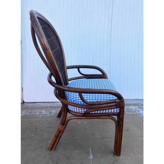 This is a stunning Boho bentwood rattan and cane chair. It features gorgeous dark rattan wood and a removable blue and...