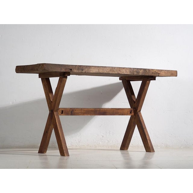 Rustic antique solid wood table (c.1900). Material: Red pine wood Age: 120 years Our rustic antique table is a unique...