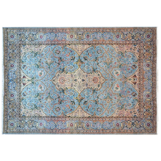 An incredible vintage Persian Tabriz rug with an unusual pattern containing a large central medallion with flowers woven...