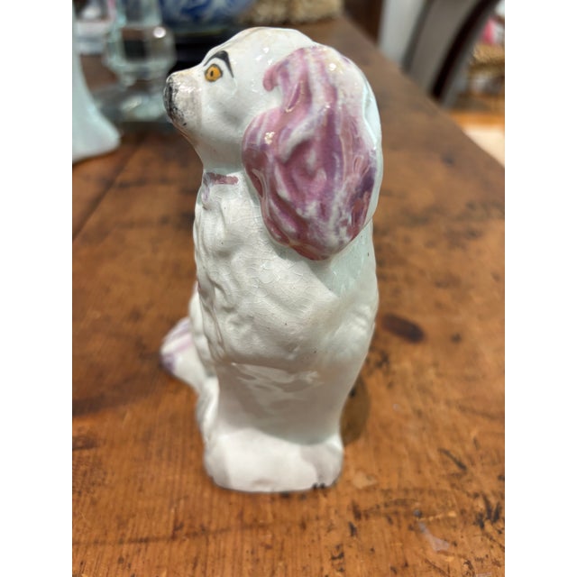 This vintage Staffordshire dog is charming and a lovely rare lavender color. I don’t have any information as to its age or...