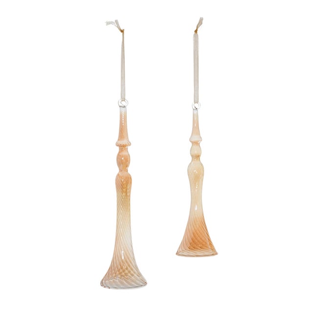 Elevate your holiday decor with the exquisite Amber Ombre Swirl Glass Drop Ornaments. This collection of glass ornaments...