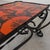 The frame of this coffee table is made of bent steel strips. Height: 38 cm. Width: 94 cm. Depth: 54 cm. Tile dimensions:...