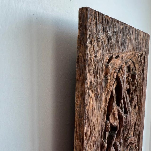 - Hand-carved wood panel - Jacobean style relief - Metal hanging bracket on back