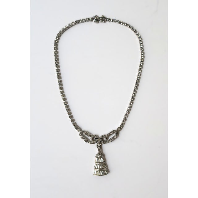 A diamond-esque (faux-diamond) necklace with faux-diamond tassel pendant, circa late-20th century. Necklace is faux-...