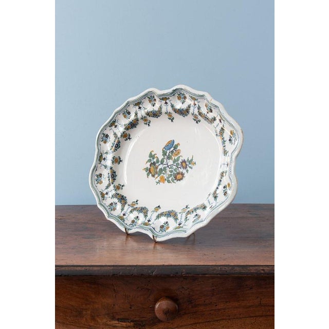 Width: 41.5 cm Depth: 31 cm Height: 5 cm A chip under the edge, invisible from the front. Minor glaze losses to the edge....
