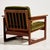 Hungarian beech armchair from the 1960s with upholstered seat and back cushions. The surface of the furniture shows...