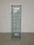 Onda series display cabinet by Ron Arad for Fiam. Elegant, caster-style cabinet made entirely of glass. The sides feature...