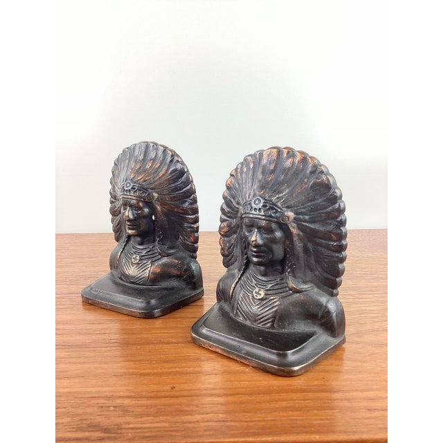 Vintage Native American Pair of Bookends made of heavy cast iron metal copper wash Indian chief with feather headdress...