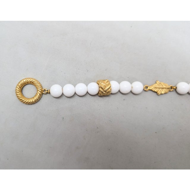 1980s Vintage 1980s Signed Givenchy Goldtone & White Resin Leaf Toggle Bracelet For Sale - Image 5 of 8