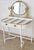 A dressing table of elegant neoclassical design, comprising a table with curved lines and a folding oval mirror. The...