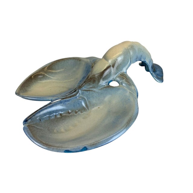 Mid-Century Modern drip glaze 2 section lobster-shaped serving dish. Marked, "Dryden" on the bottom.
