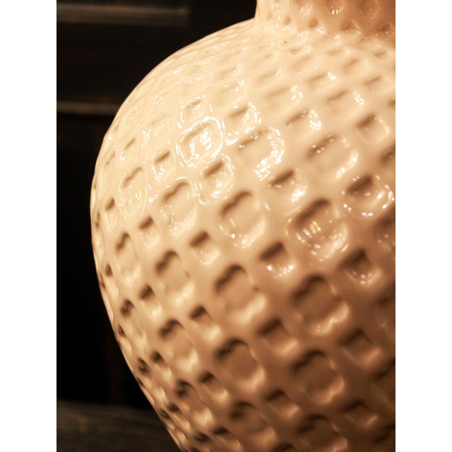 Elegant pair of large table lamps made in Manises, Spain, in a beautiful soft cream tone. They feature an appealing...