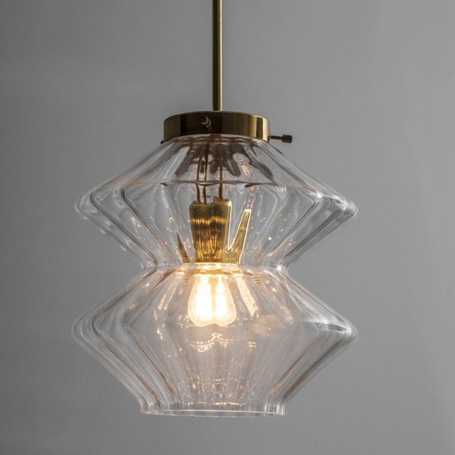 Produced by Chandeliers n.p. Kamenický Šenov under the Preciosa brand in the 1970s, this pendant lamp exemplifies the...