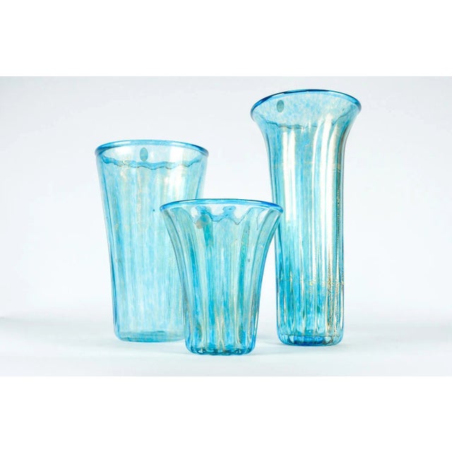Set of three turquoise Murano glass vases with gold flecks. Tall vase: 7"Dia x 14"H. Medium vase: 7.5"Dia x 12"H. Short...