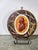 This piece is a decorative portrait medallion featuring a profile silhouette of Josiah Wedgwood I, crafted using...