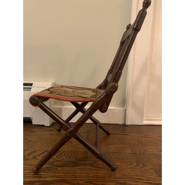 Unique child's camp chair with adorable dog carpet seat. This style of chair dates back to the Civil War, although the...