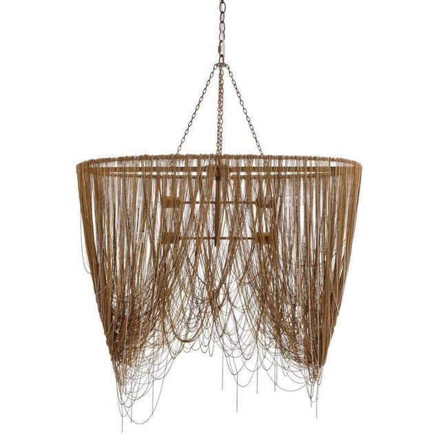 Cascading swags of fine brass chain in antique brass and nickel finishes make this chandelier a dramatic addition to any...
