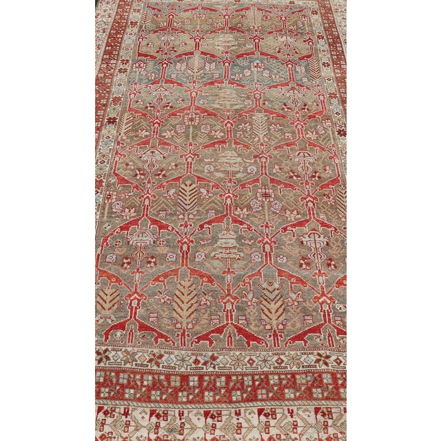 Antique Kurdish runner antique with tribal geometric medallions in soft green, brown, red, cream and tans. rug...