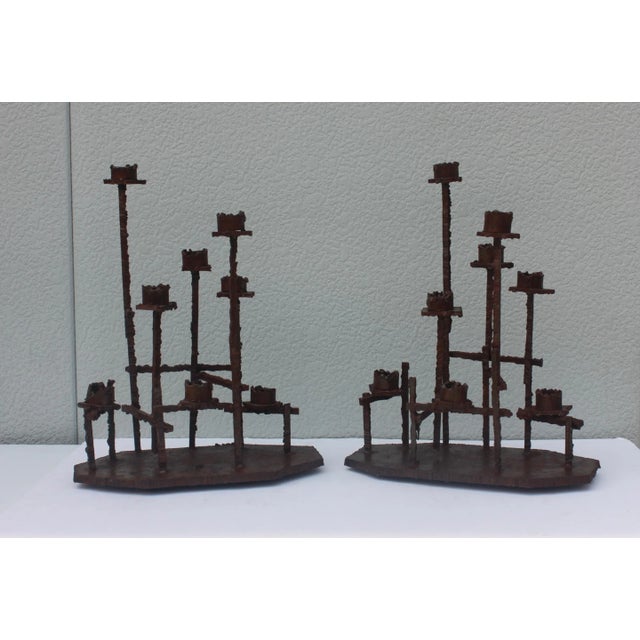 Stunning pair of large 1970s welded rusted steel brutalist candlesticks attributed to Paul Evans, in vintage condition...