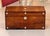 19th century rosewood box with line inlay and mother of pearl roundels, including a mother of pearl escutcheon. The...
